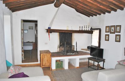 Bauernhaus kaufen Siena, Toskana:  RIF 3071 Wohnraum mit Kamin